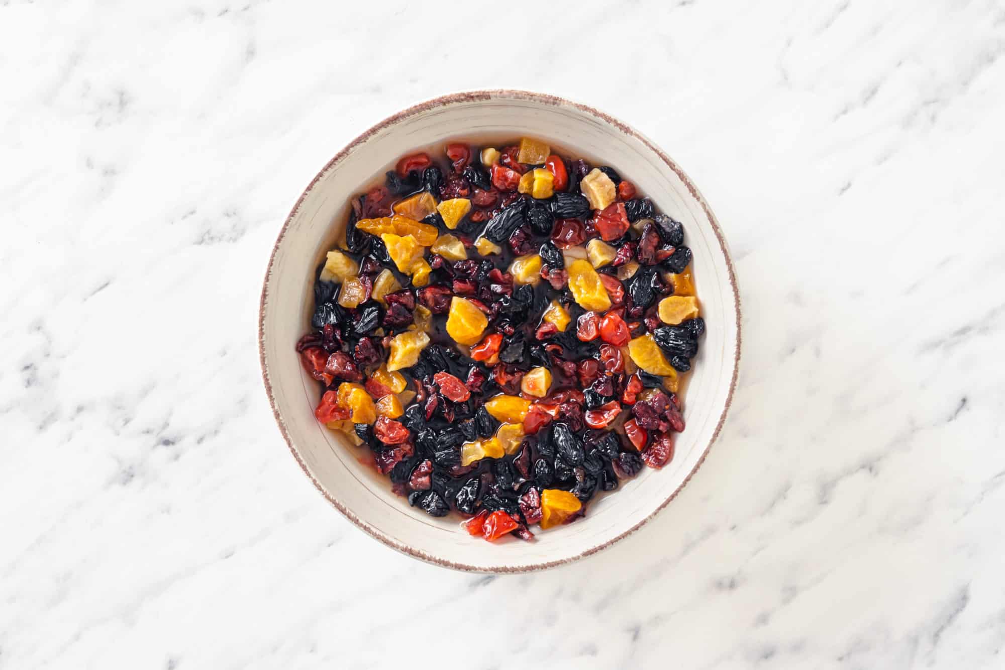 dried fruits in a white bowl.