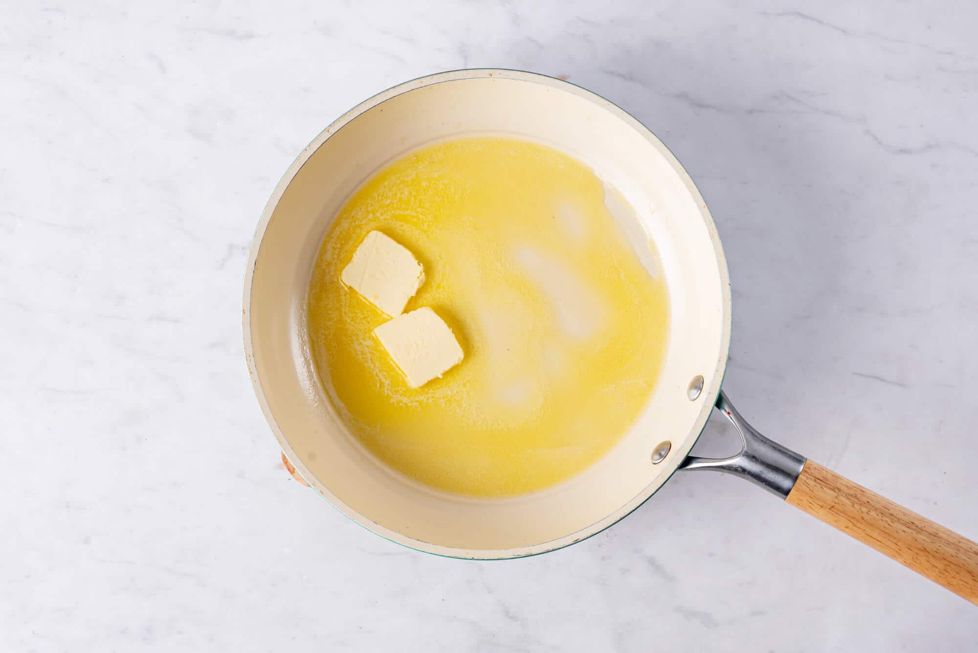 Butter melting in a skillet. 