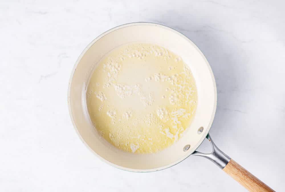 Melted butter in a skillet.