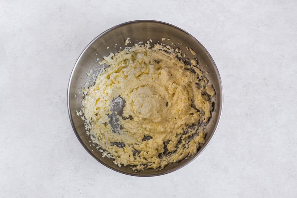 cream-cheese-and-butter-mixing-in-a-silver-bowl