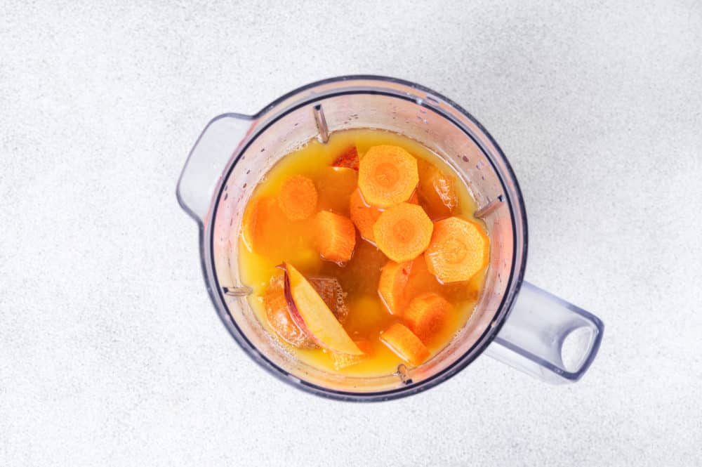 prepared smoothie ingredients in a blender.