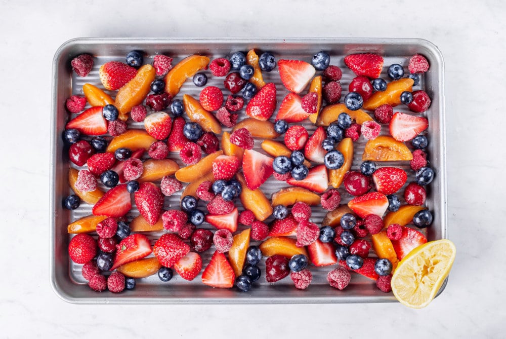 Chopped fresh fruits on a cooking board.