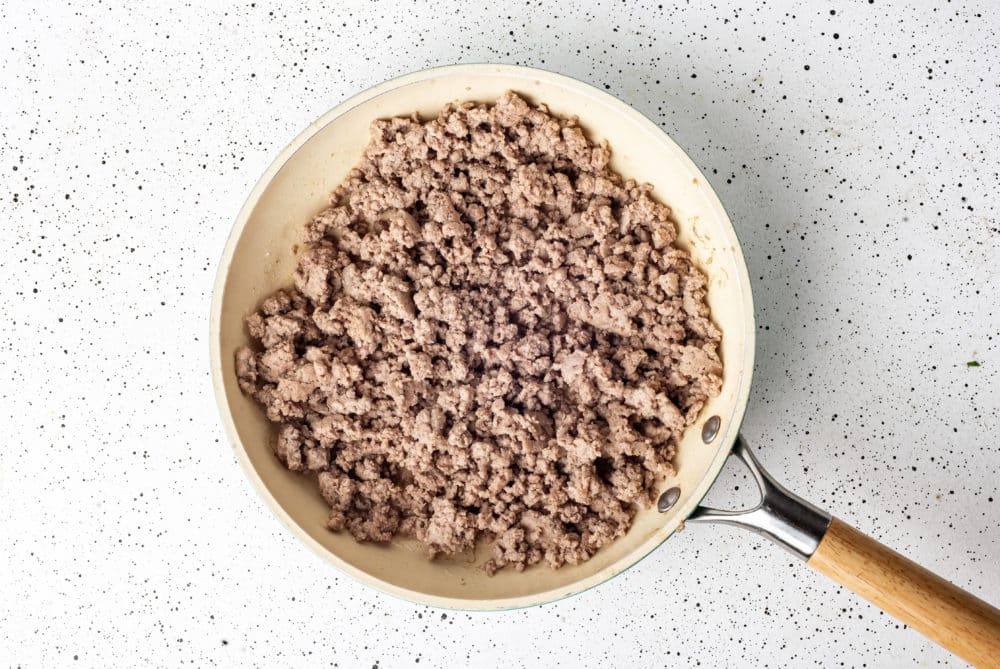 Cooked ground turkey in a skillet.