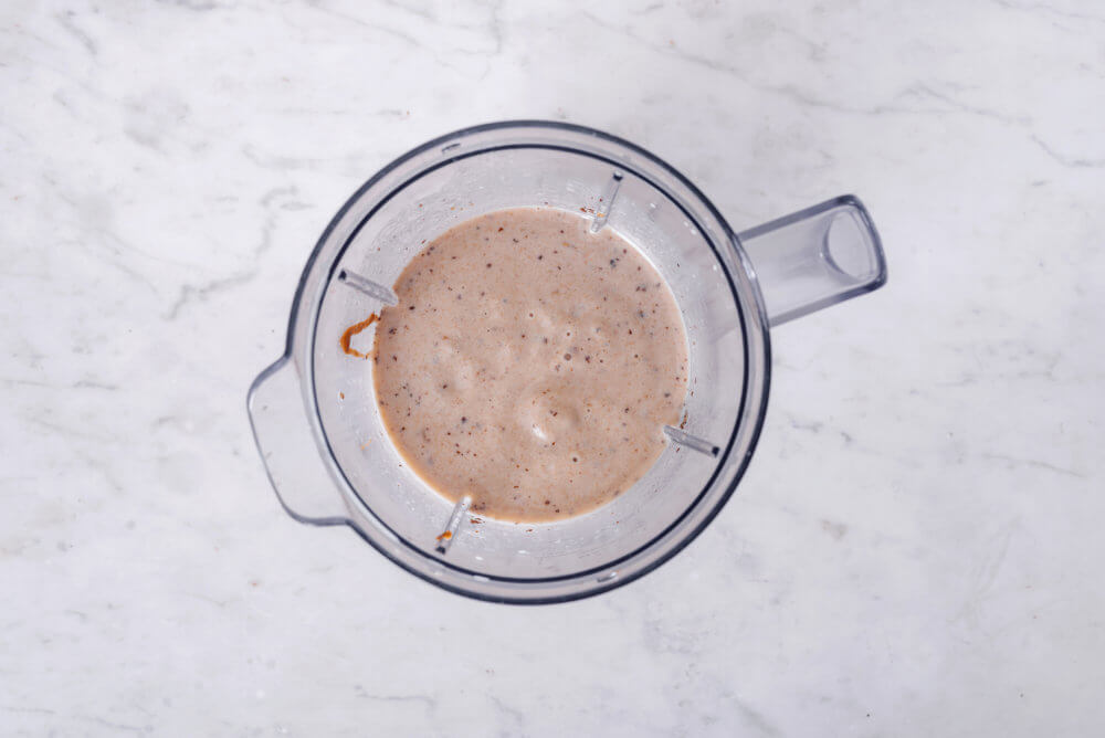 caramel smoothie blended in a blender.