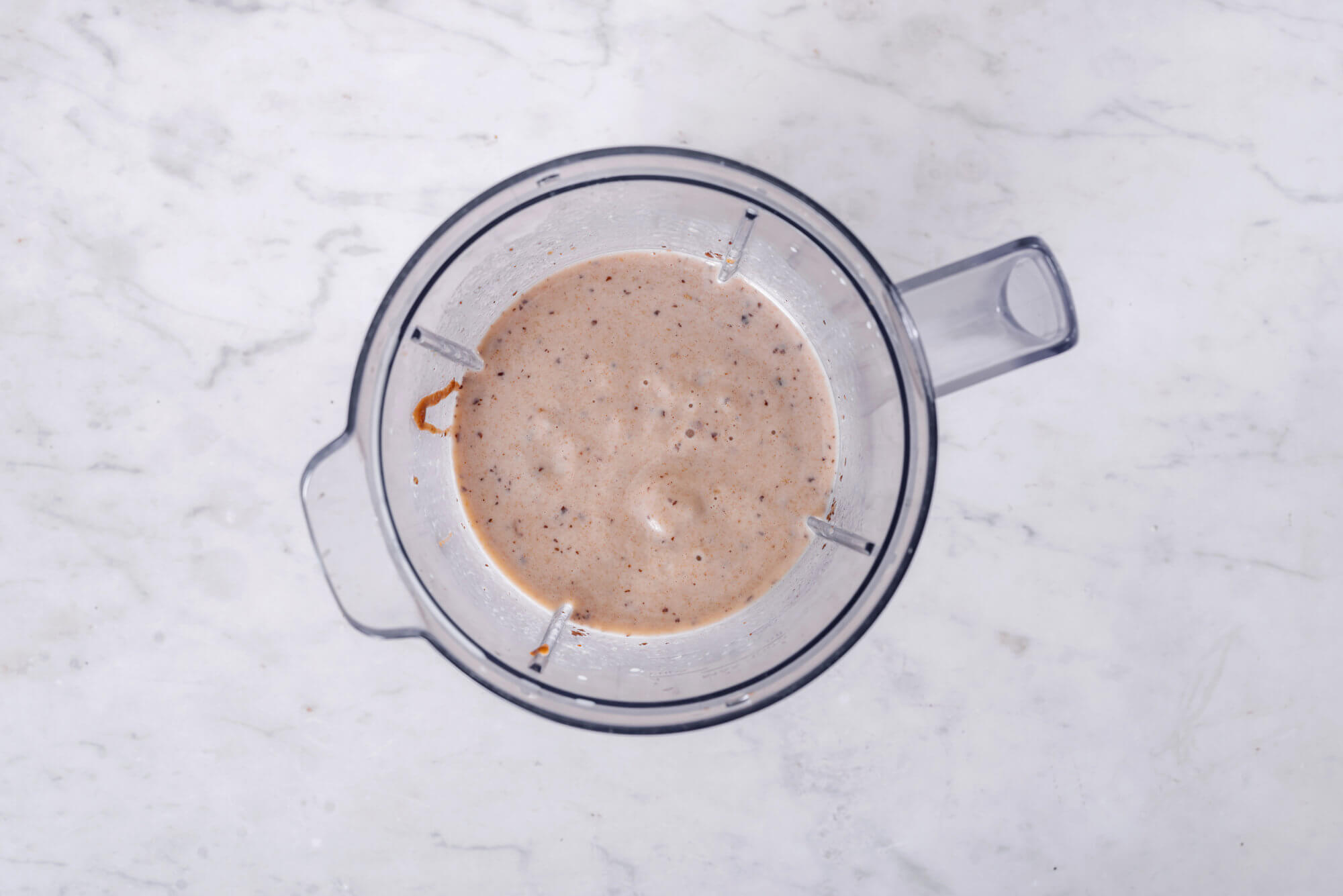 blended healthy caramel smoothie in blender. 