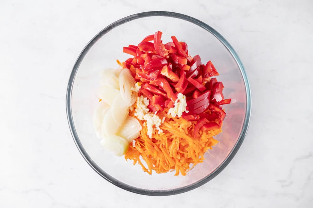 marinated-eggplant-salad-carrots-red-bell-pepper-onion-and-garlic-chopped-in-a-clear-bowl