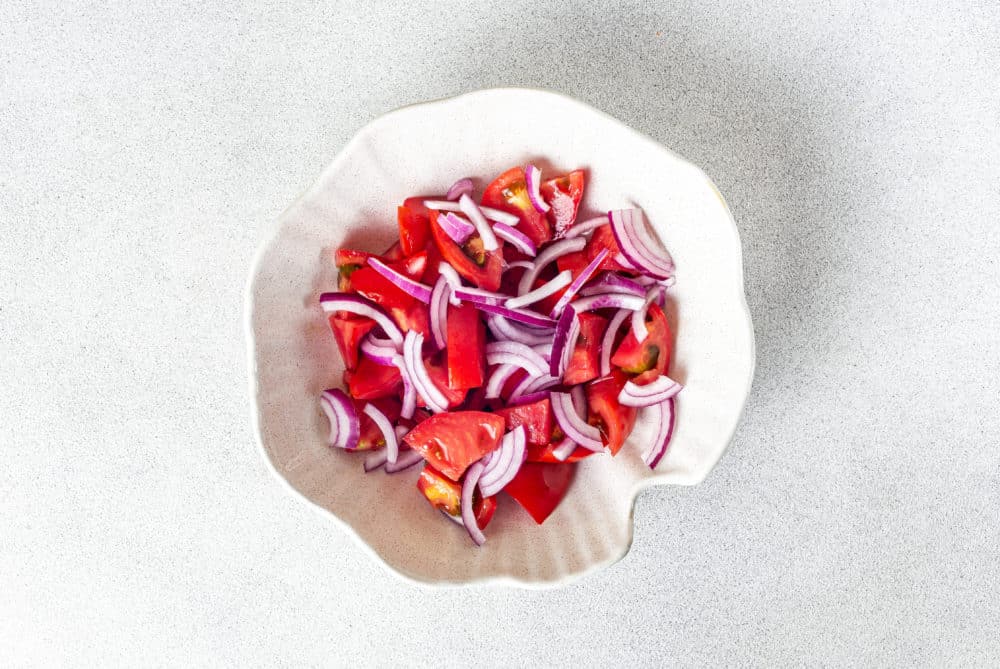 tomatoes-and-red-onion-in-a-white-bowl