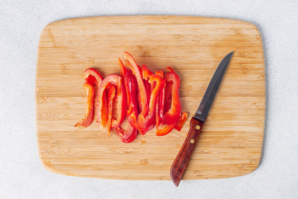 sliced red pepper on a board.