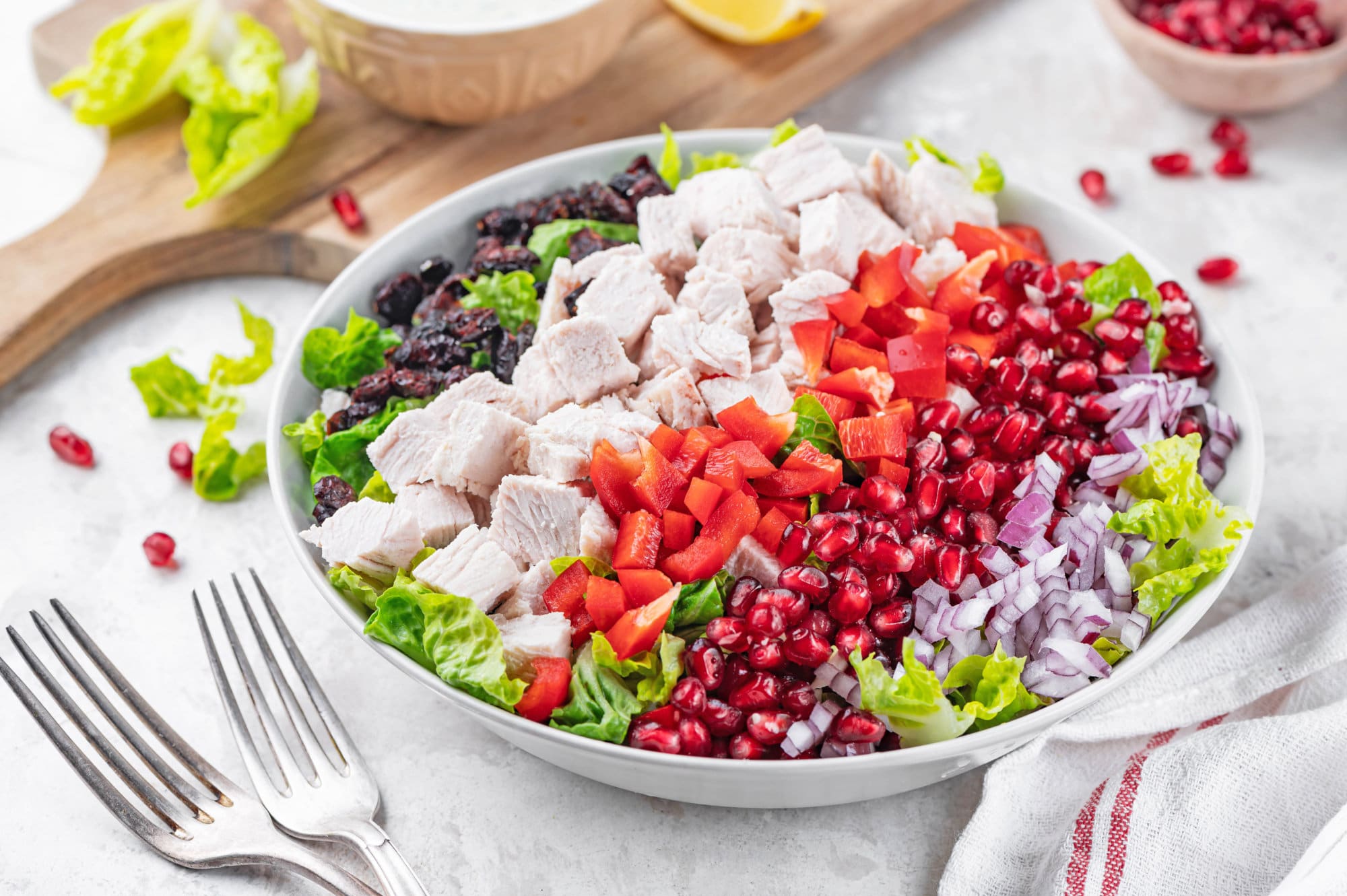 turkey-salad-recipe-on-a-white-plate-with-a-silver-fork