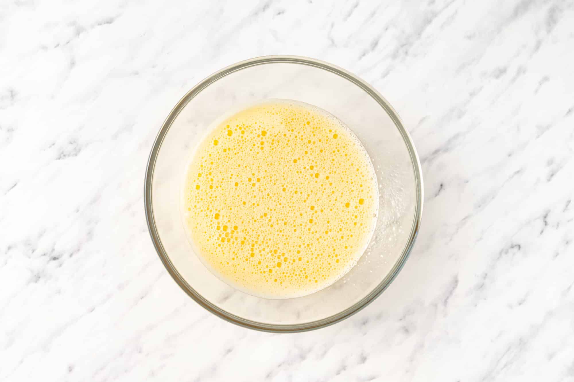 Cake batter in a glass bowl.