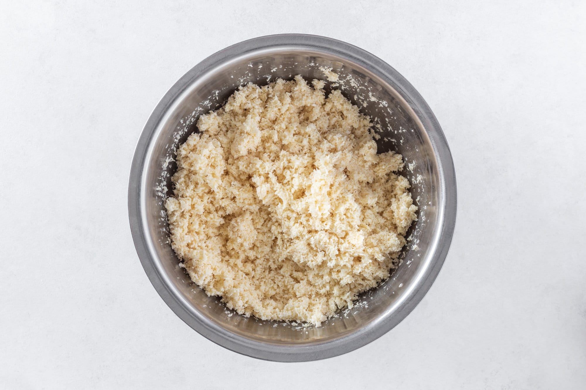 Macaroon mix in a silver bowl.