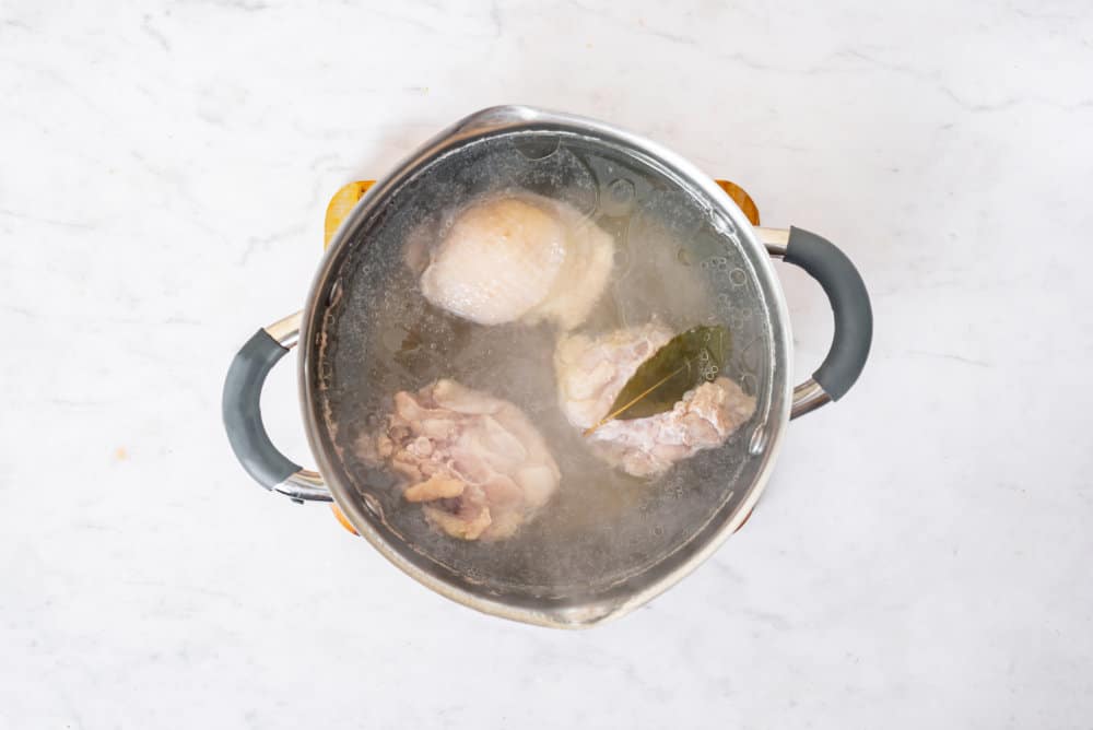 broth-cooking-in-a-silver-soup-pot