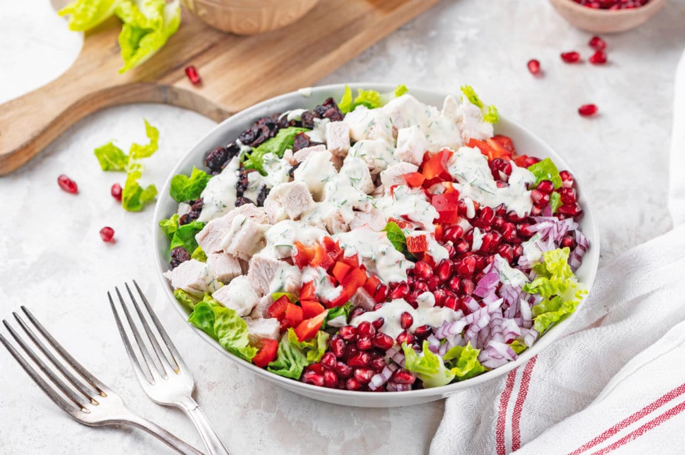 turkey-salad-recipe-on-a-white-plate-with-a-silver-fork