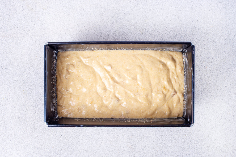 banana bread dough in a loaf pan ready to be baked.