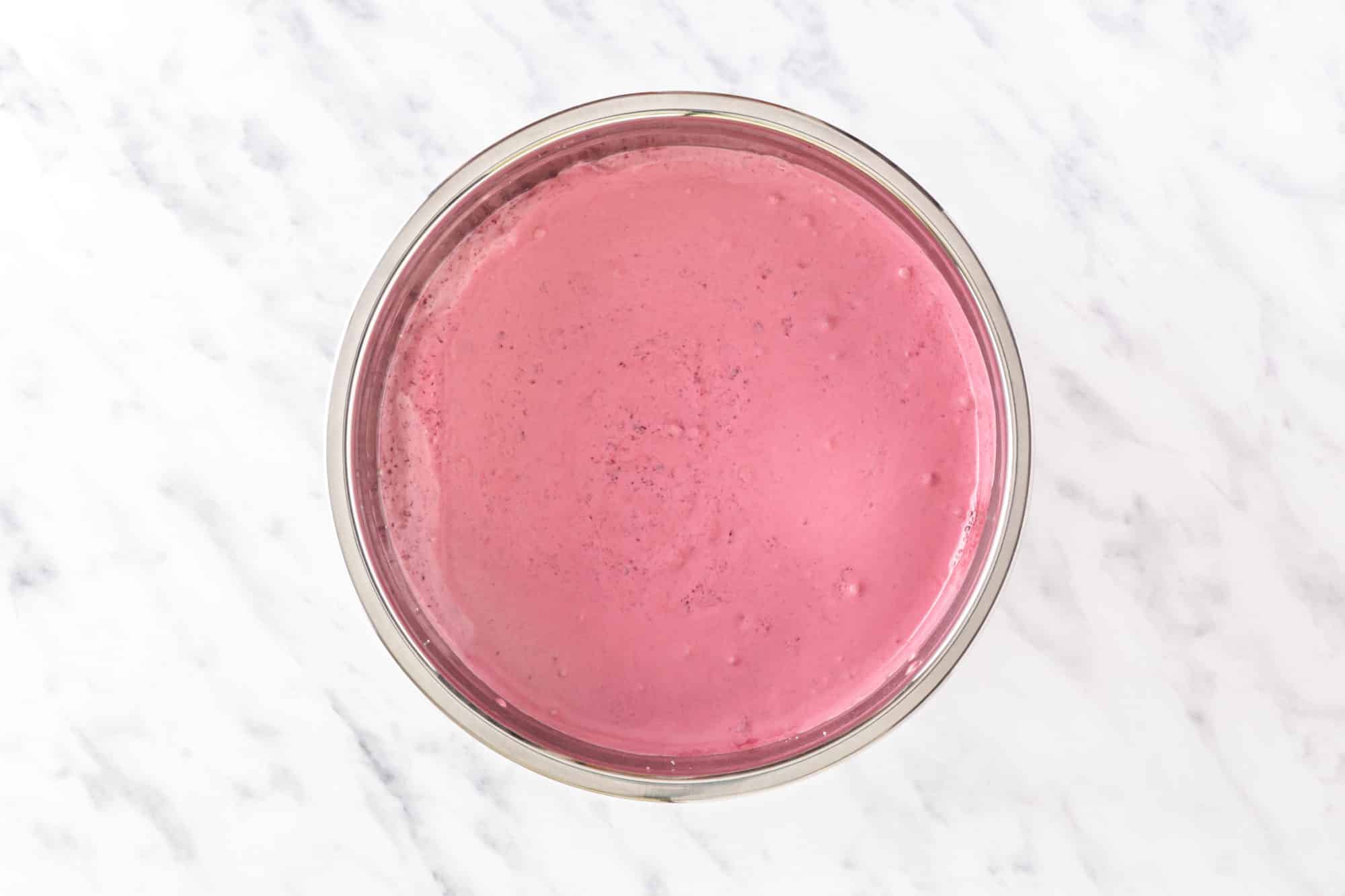 Cherry ice pop mix in a silver bowl.