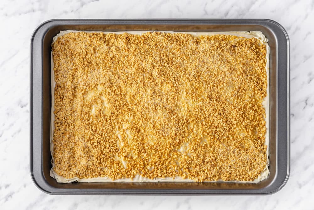 layers of baklava in a baking tray.