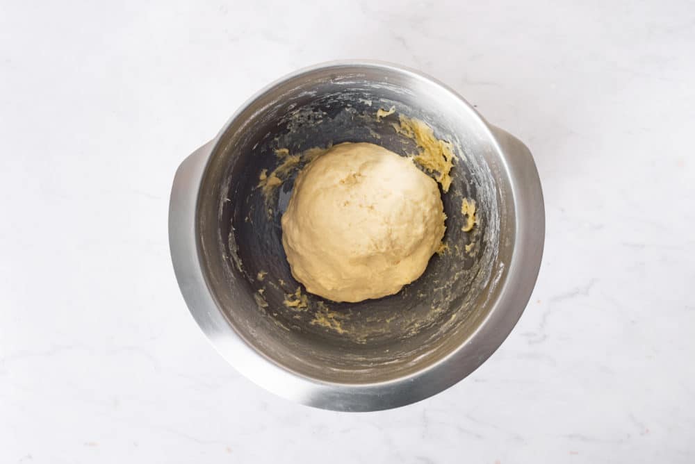 Dough for piroshki in a bowl.