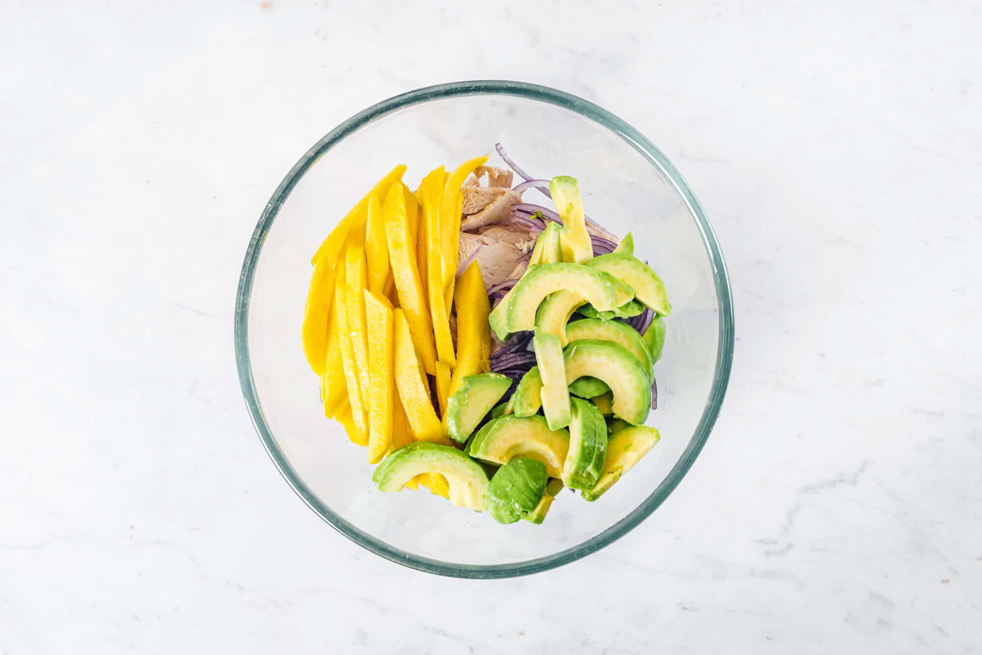 avocado-chicken-salad-ingredients-in-a-glass-bowl