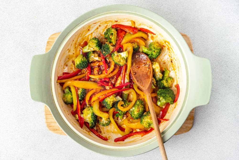 veggies cooking in a pot.