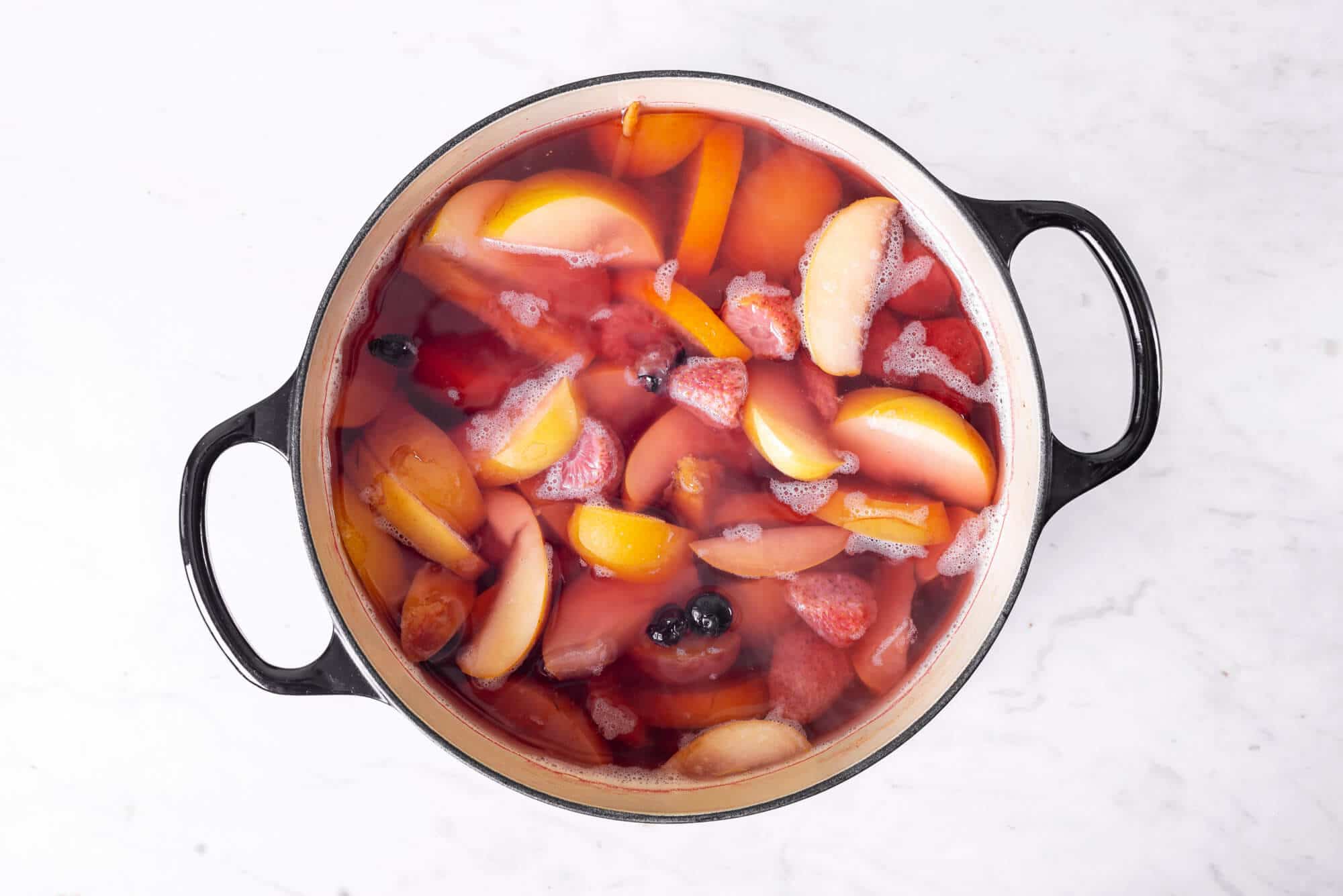 fruits-and-water-cooking-in-a-large-pot