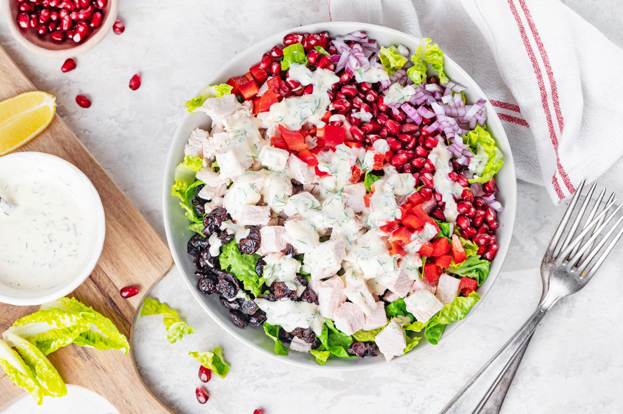 turkey-salad-recipe-on-a-white-plate-with-a-silver-fork