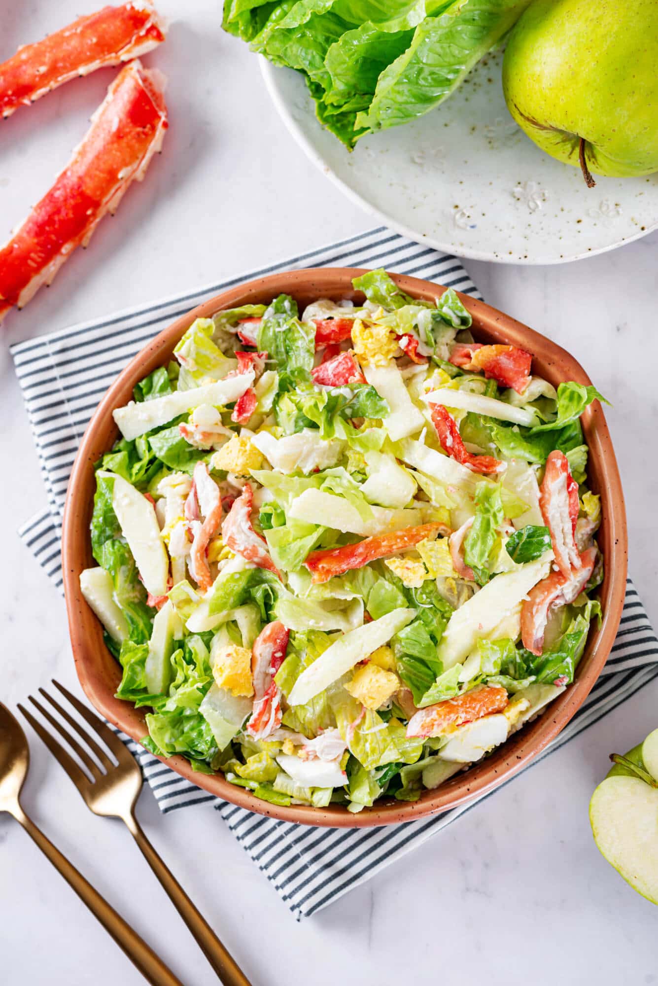 Simple crab and apple salad in a bowl on a napkin ready to enjoy.