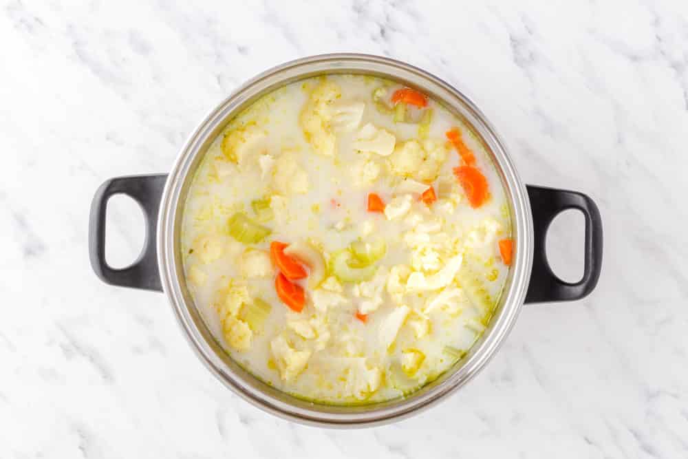 cauliflower soup cooking in a pot.