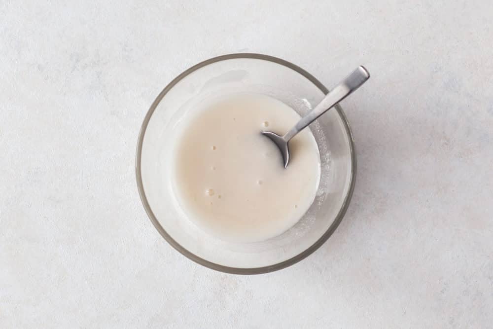 glaze-in-a-clear-bowl-with-a-spoon-for-pumpkin-muffins