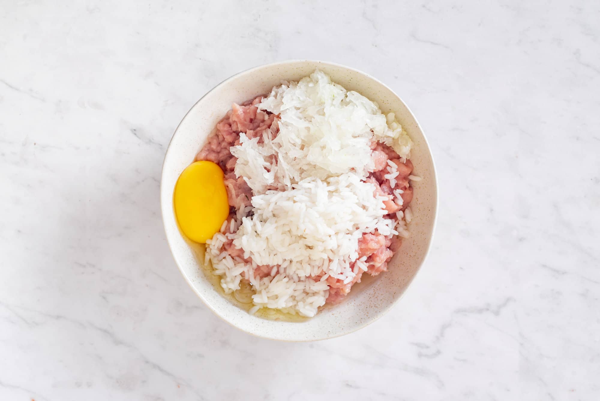 meat-rice-and-egg-in-a-white-bowl