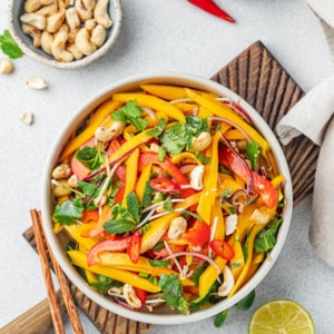 a white bowl filled with mixed thai chopped salad.