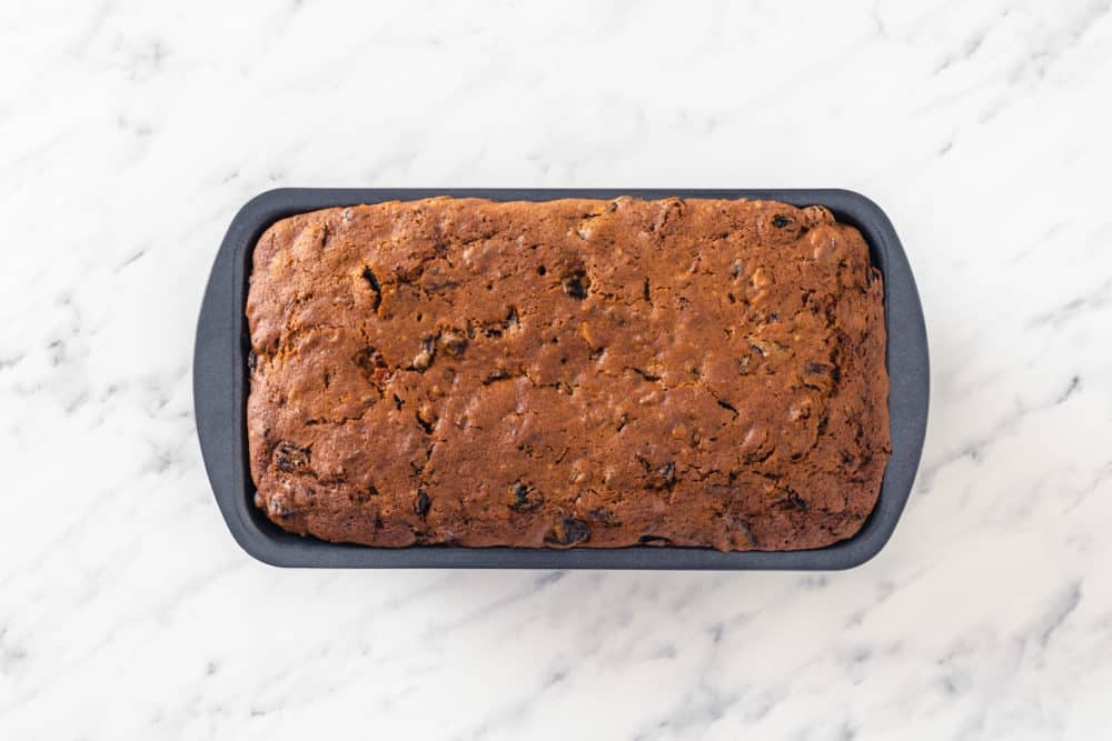 baked fruit cake in a loaf pan.