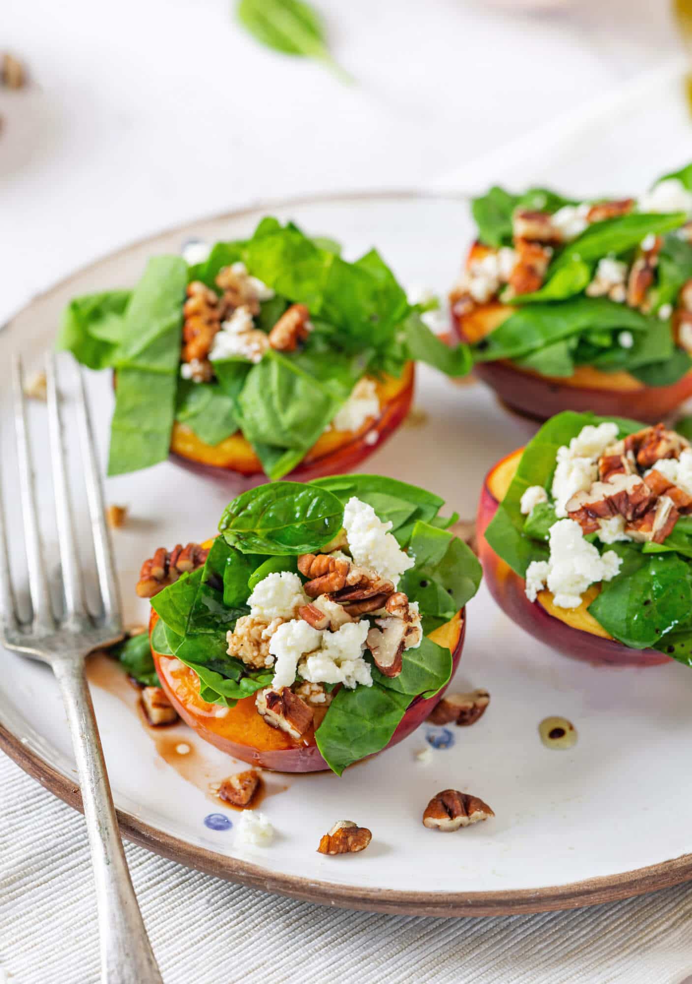 nectarine-salad-on-a-white-plate-with-a-fork