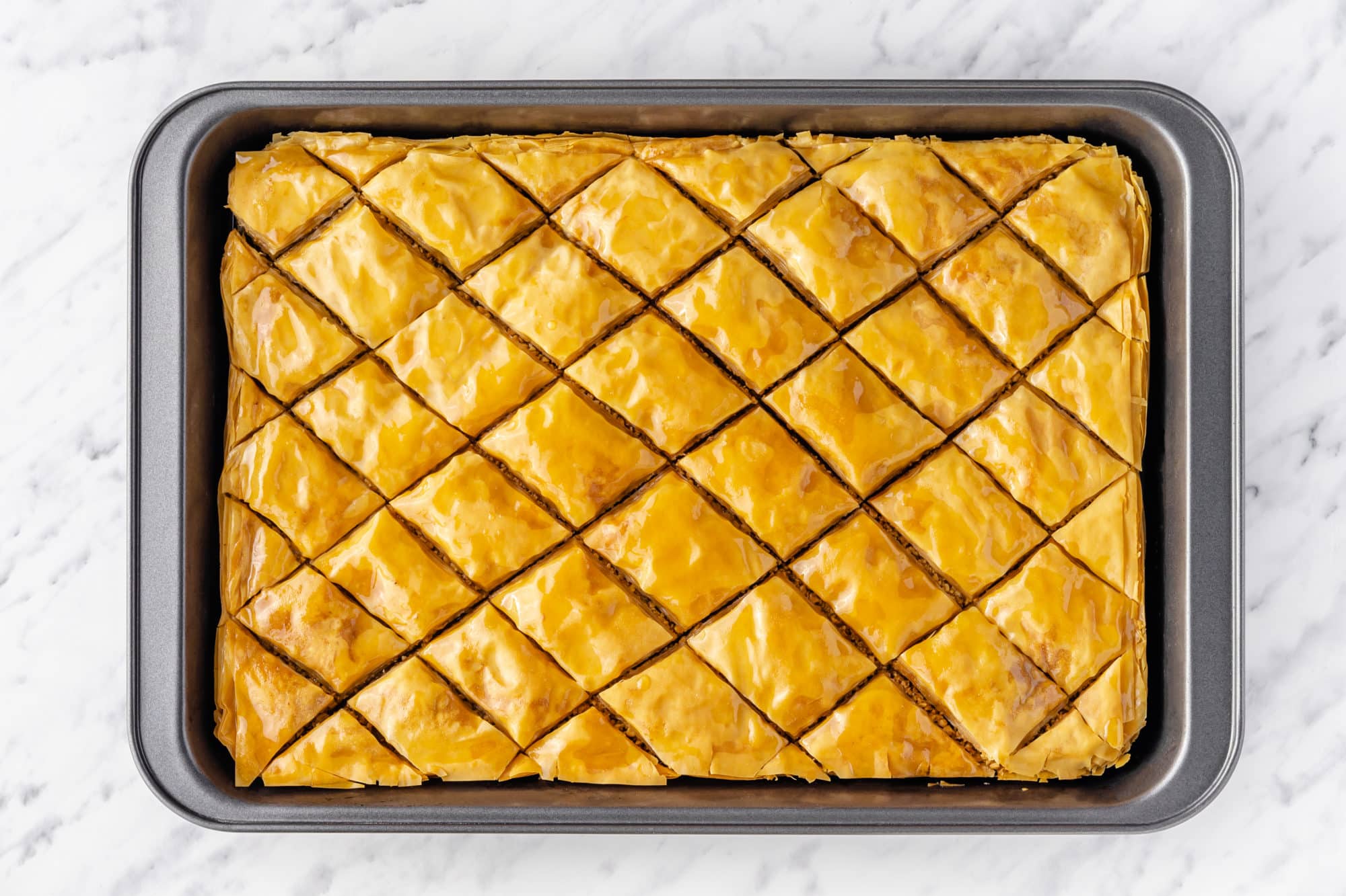 baked and cut baklava in the baking tray.