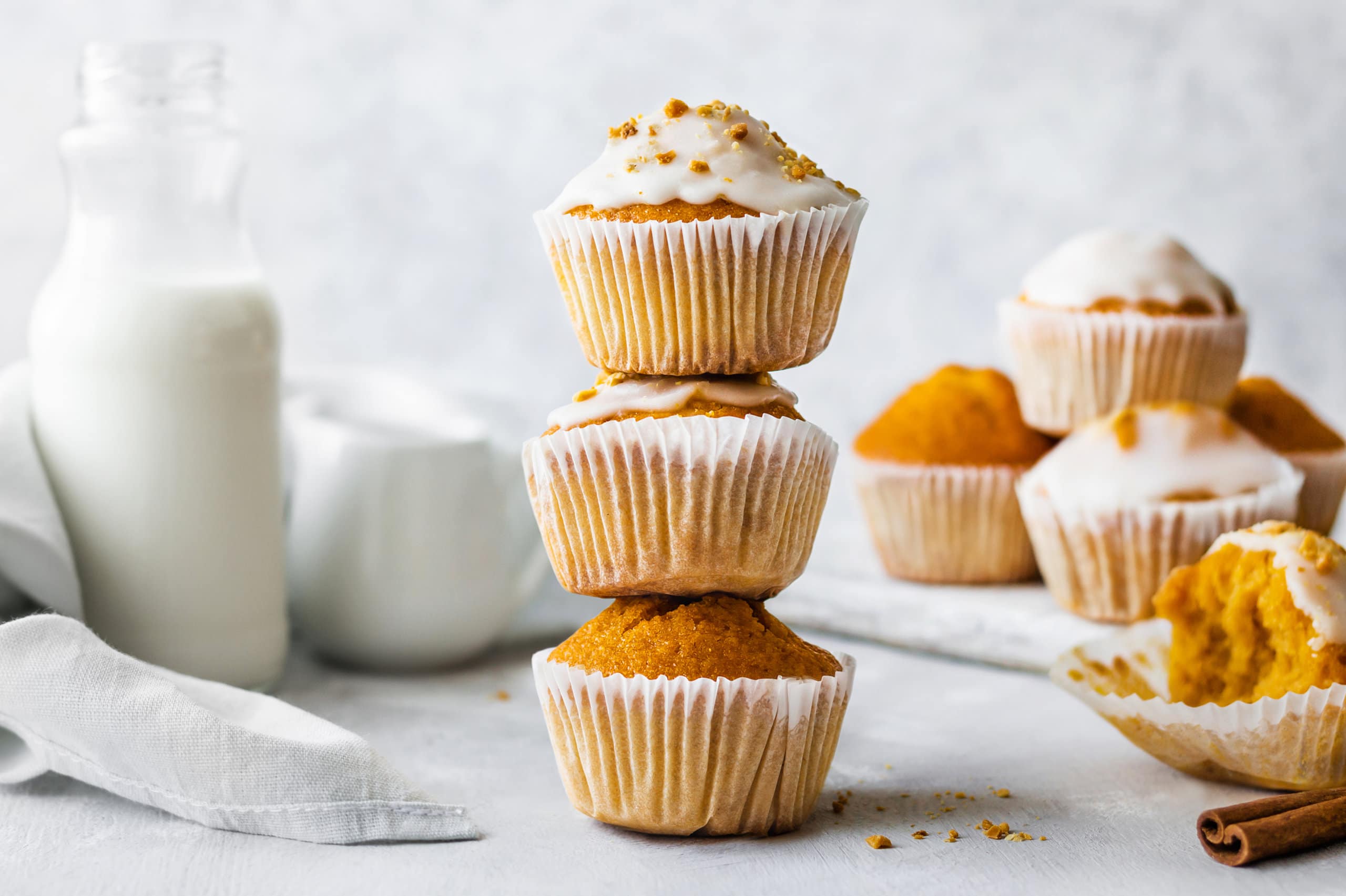 a stack of pumpkin puffins with glaze on top.