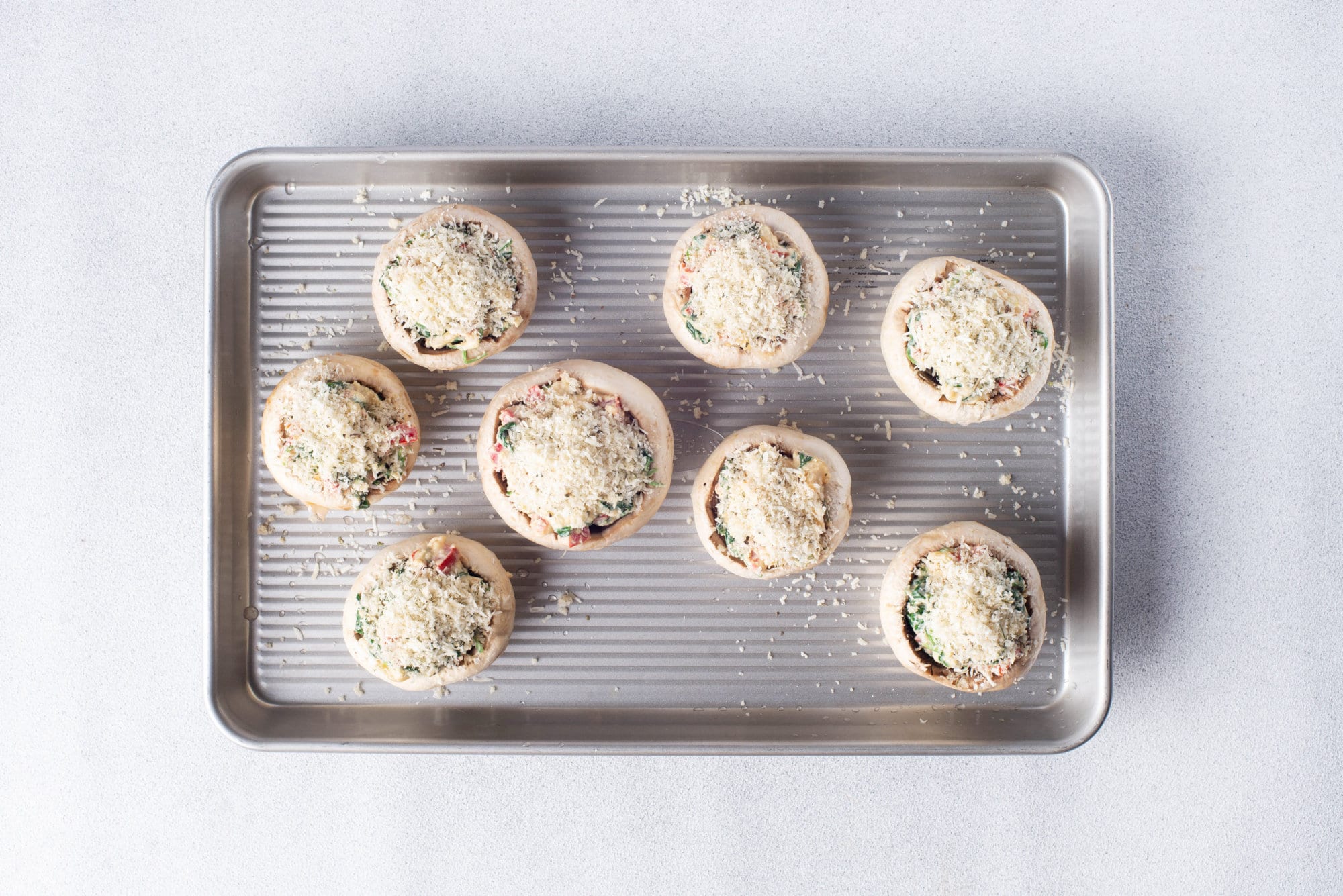 unbaked-stuffed-mushroom-bites-on-baking-tray