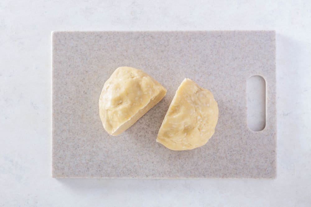 a ball of dough on a cutting board.