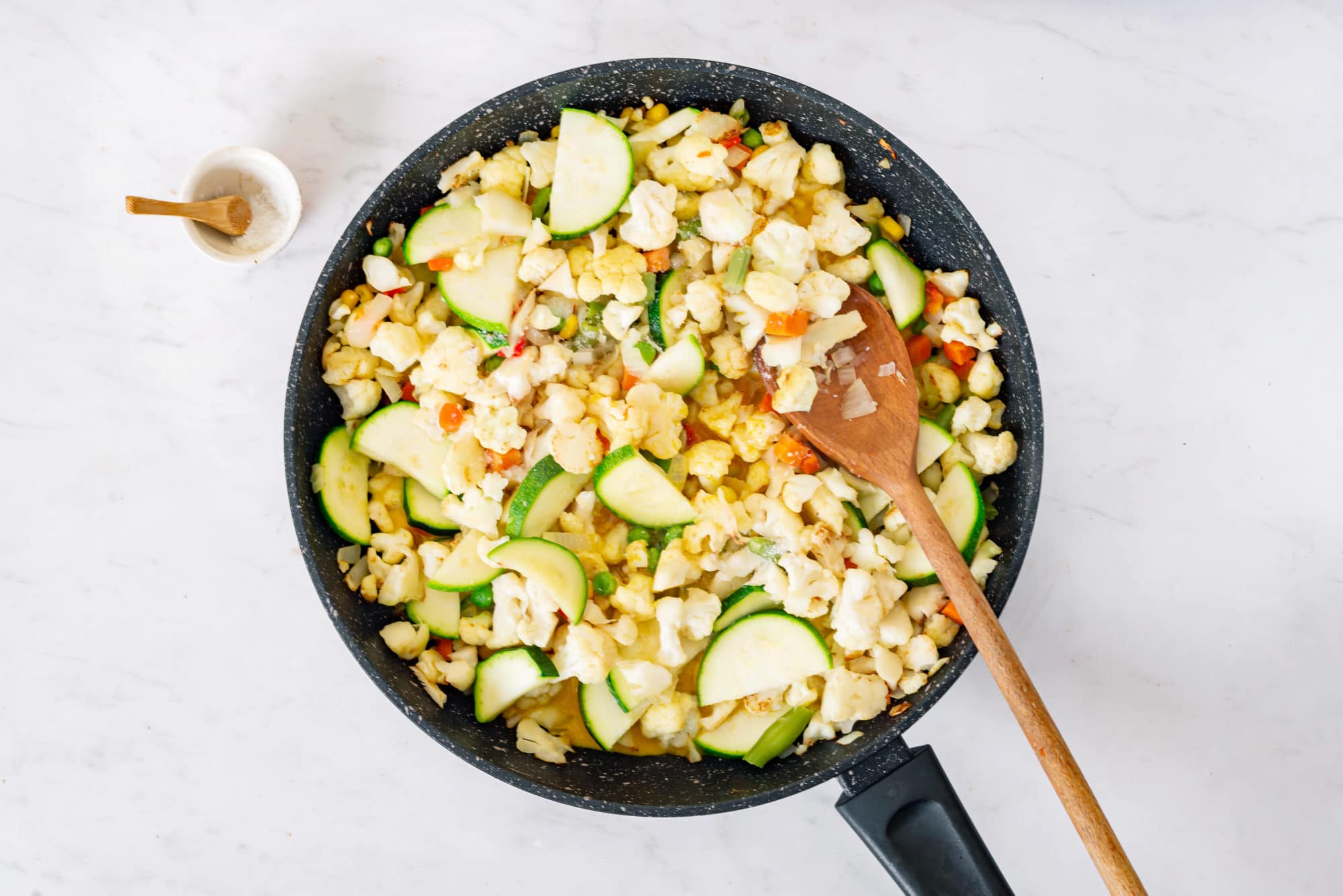 Cooking cauliflower rice in a skillet