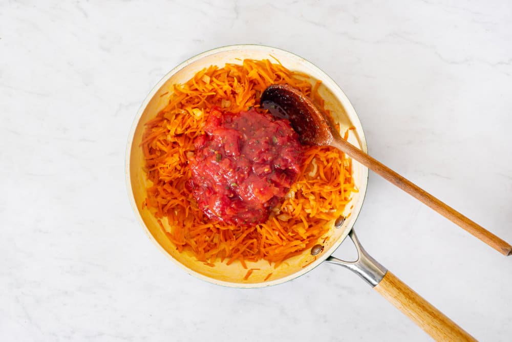 sauteing-soup-ingredients-in-a-skillet-with-a-wooden-spoon