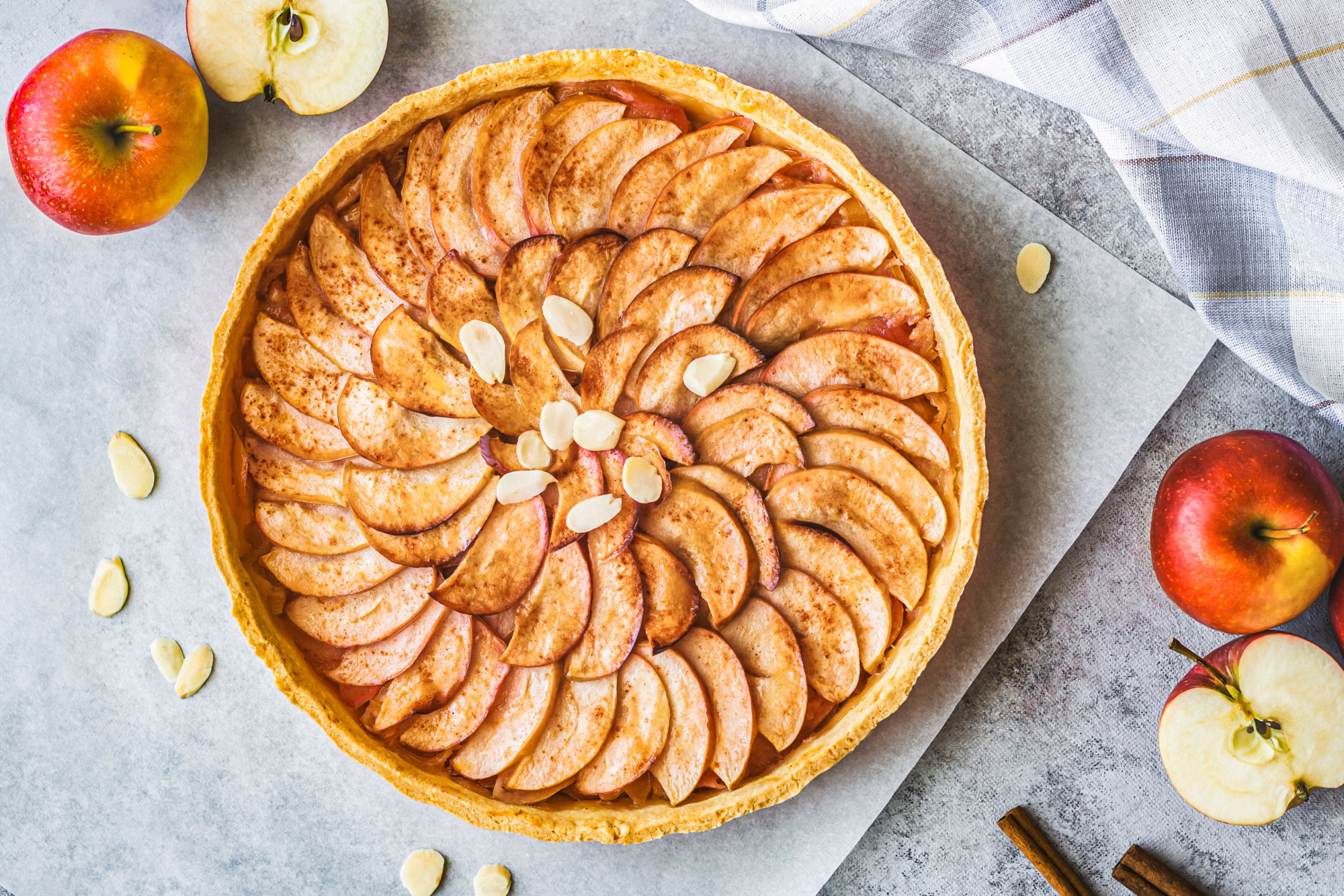 Apple tart on parchment paper. 