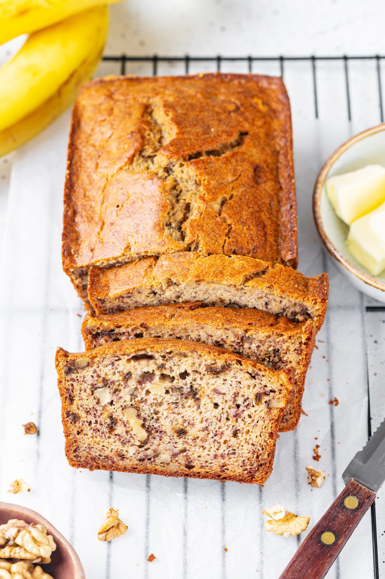 Banana bread sliced on a wire rack 