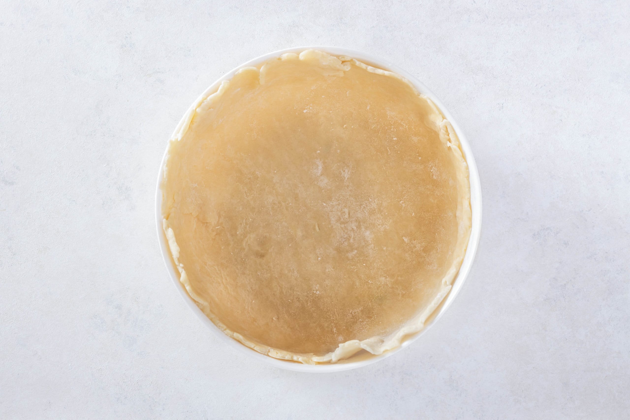 chicken pot pie crust pushed into a baking dish