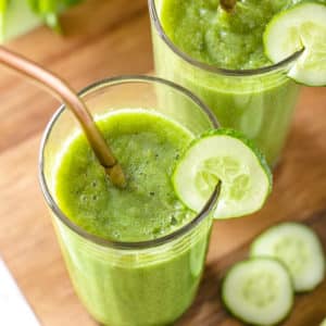 a smoothie in a glass with a straw.