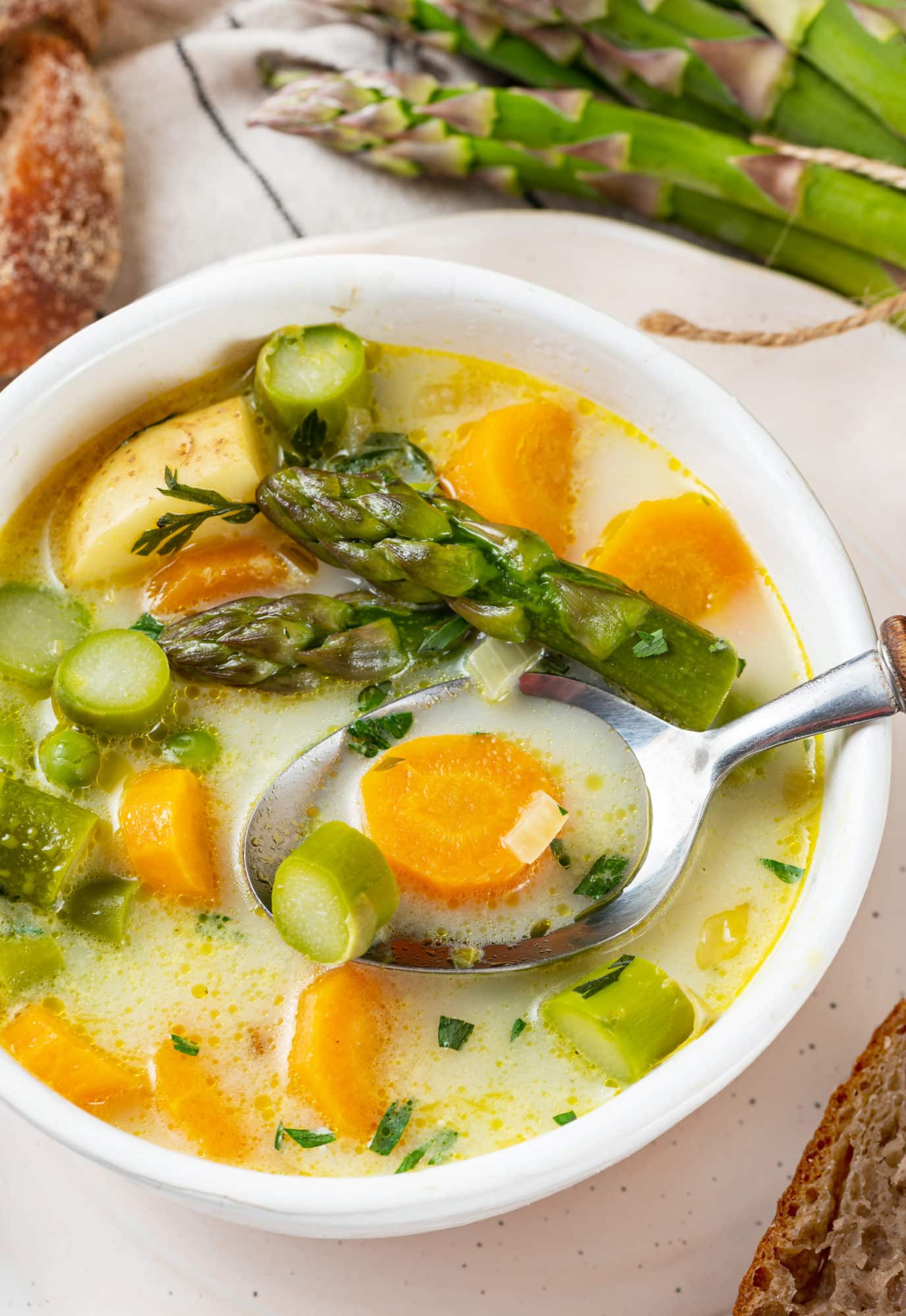 asparagus-soup-in-a-white-bowl-with-a-spoon