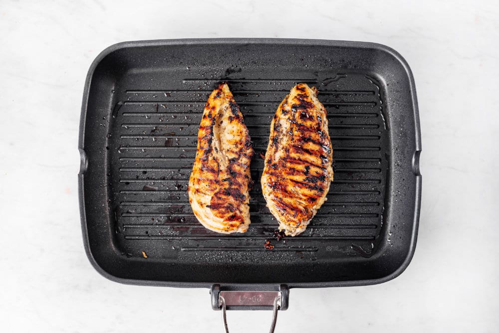 grilled chicken on a black pan.