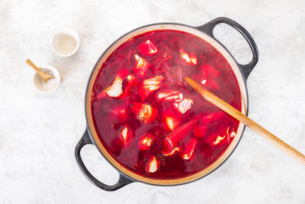 Meat added into the borscht soup pot.