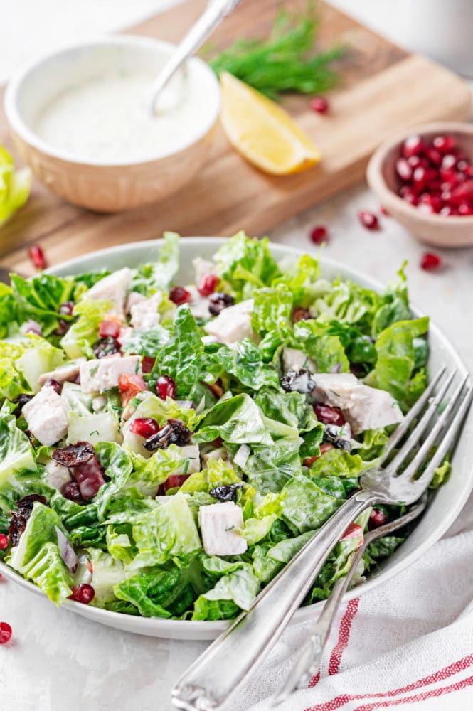 Left over turkey mixed salad in a white bowl.