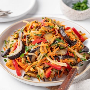 eggplant-salad-on-white-plate-with-spoon