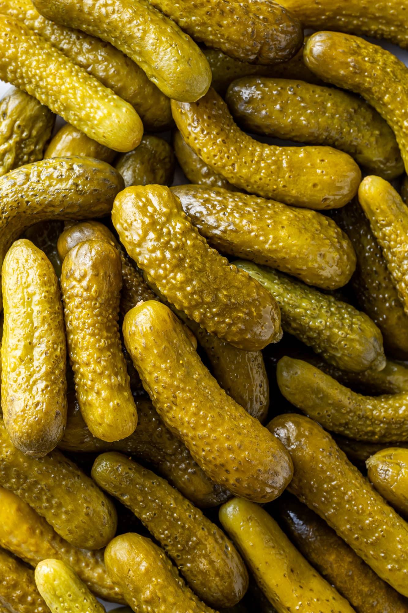 close up of dill pickles.