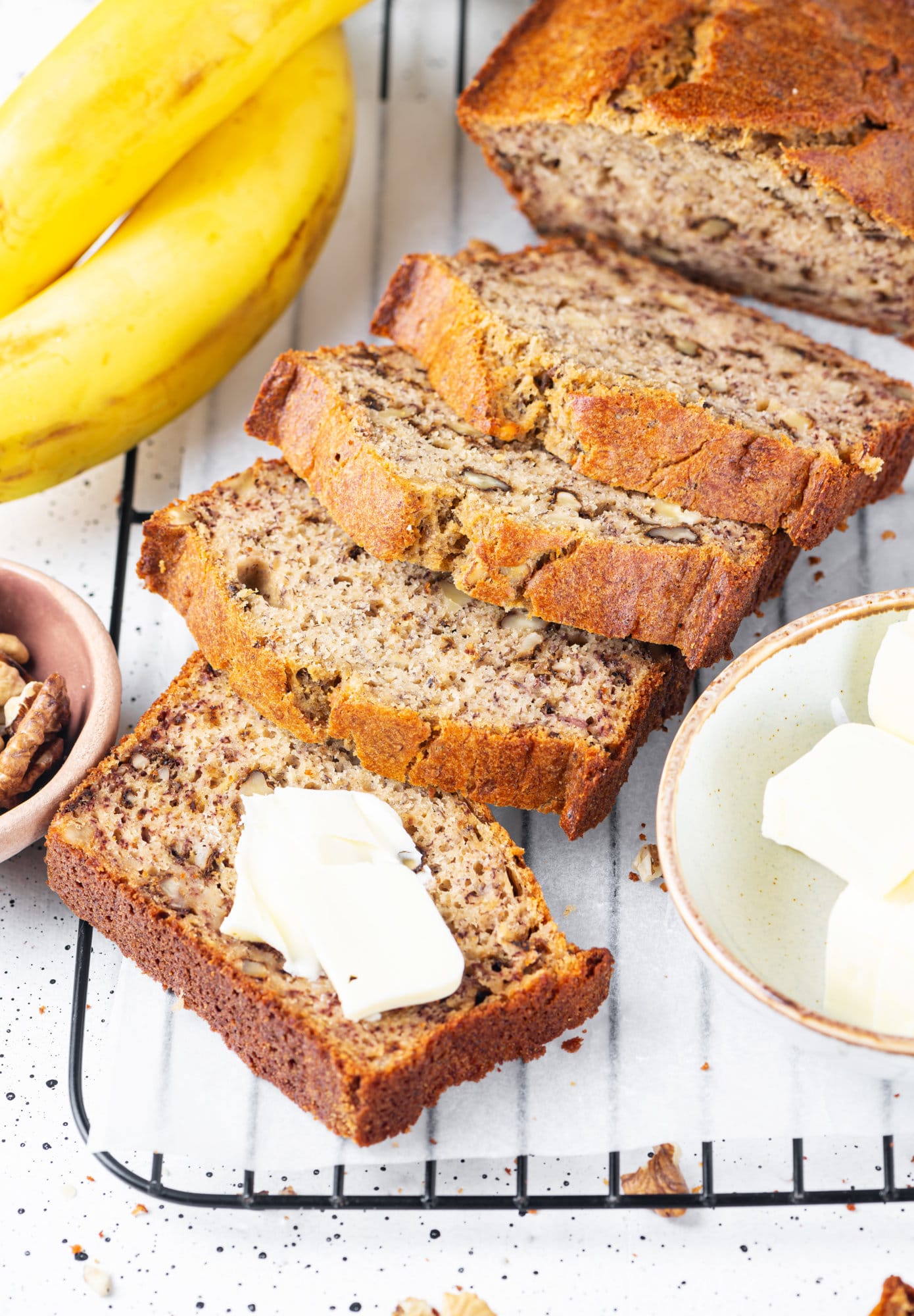 Banana bread sliced on a wire rack