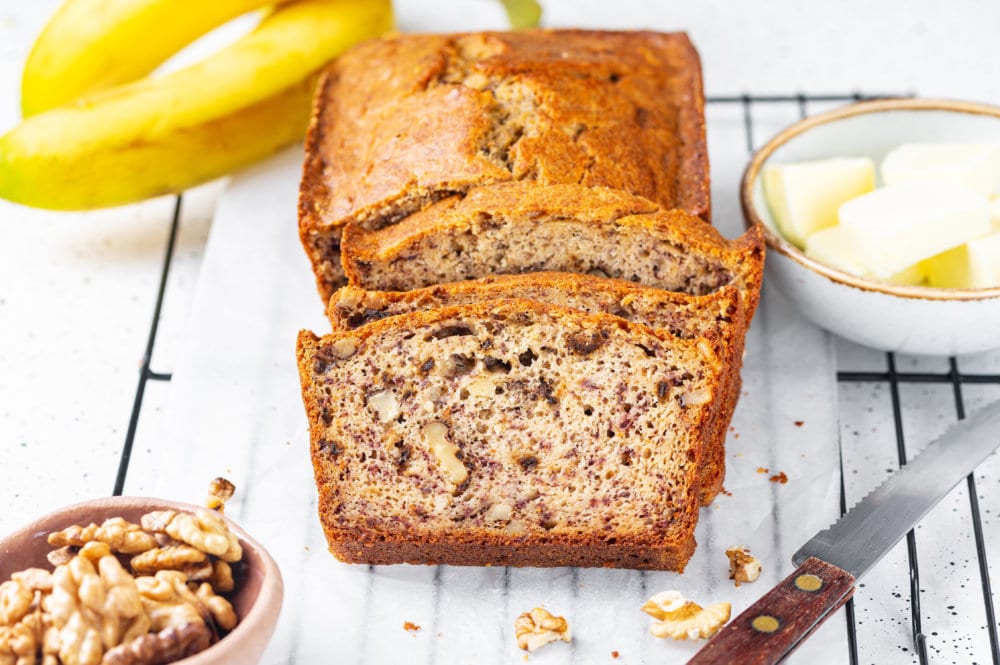 banana bread slices on a wire rack.